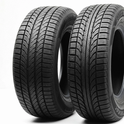 Three different types of tires (summer, winter, all-season) arranged side-by-side on a clean, light background